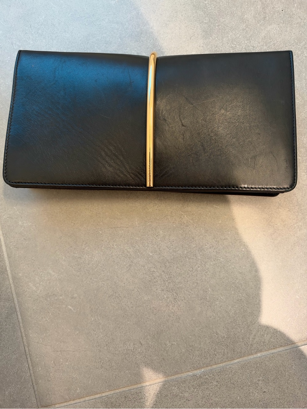Nina Ricci Black Leather ‘Arc’ Clutch with Gold Bar Accent